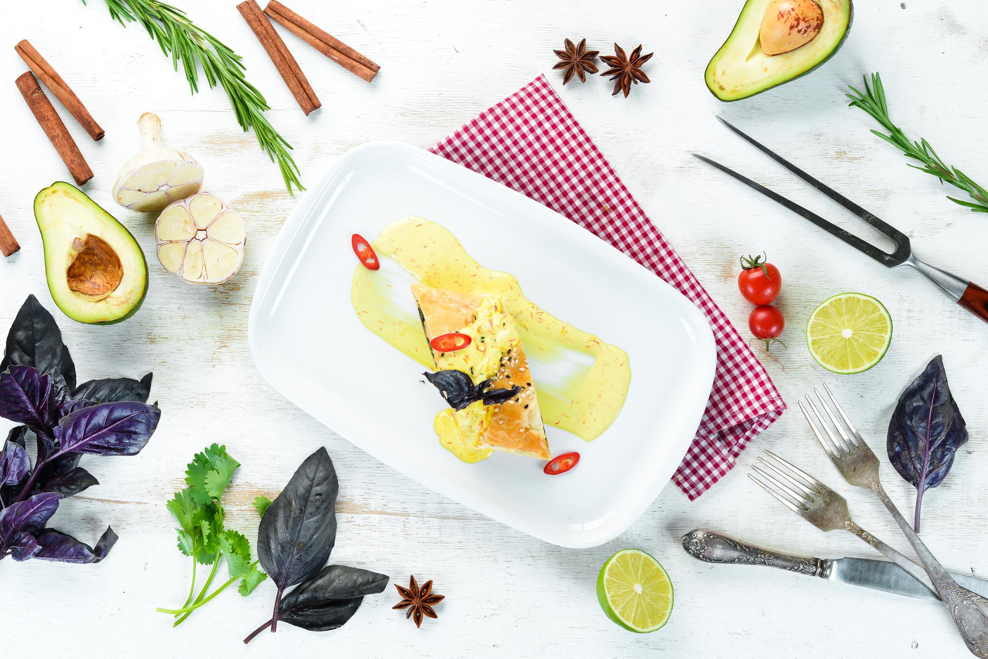 Flat lay of recipe cards and plated course